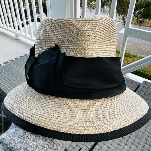 Albertus Swanepoel fedora. Natural raffia w/ shiny thread. Black satin band/bow. Women